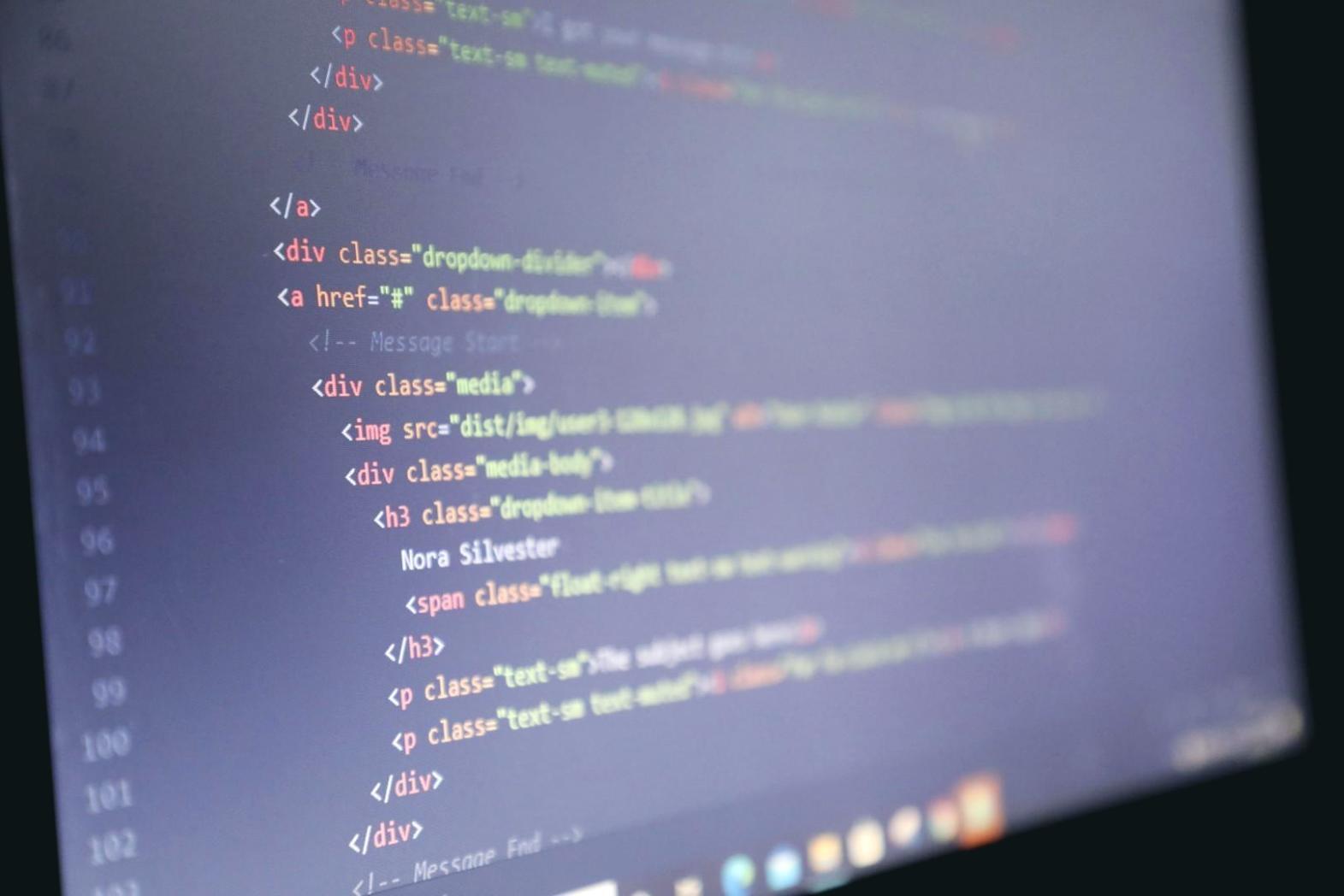 Creative professional working with AI tools at a desk